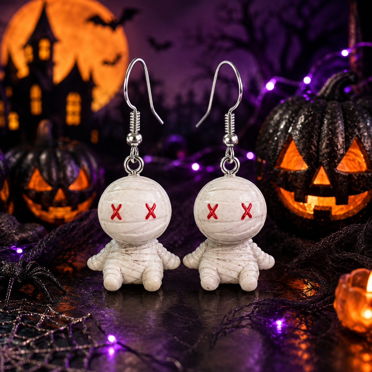 Sitting Mummy Dangle Earrings on Halloween background
