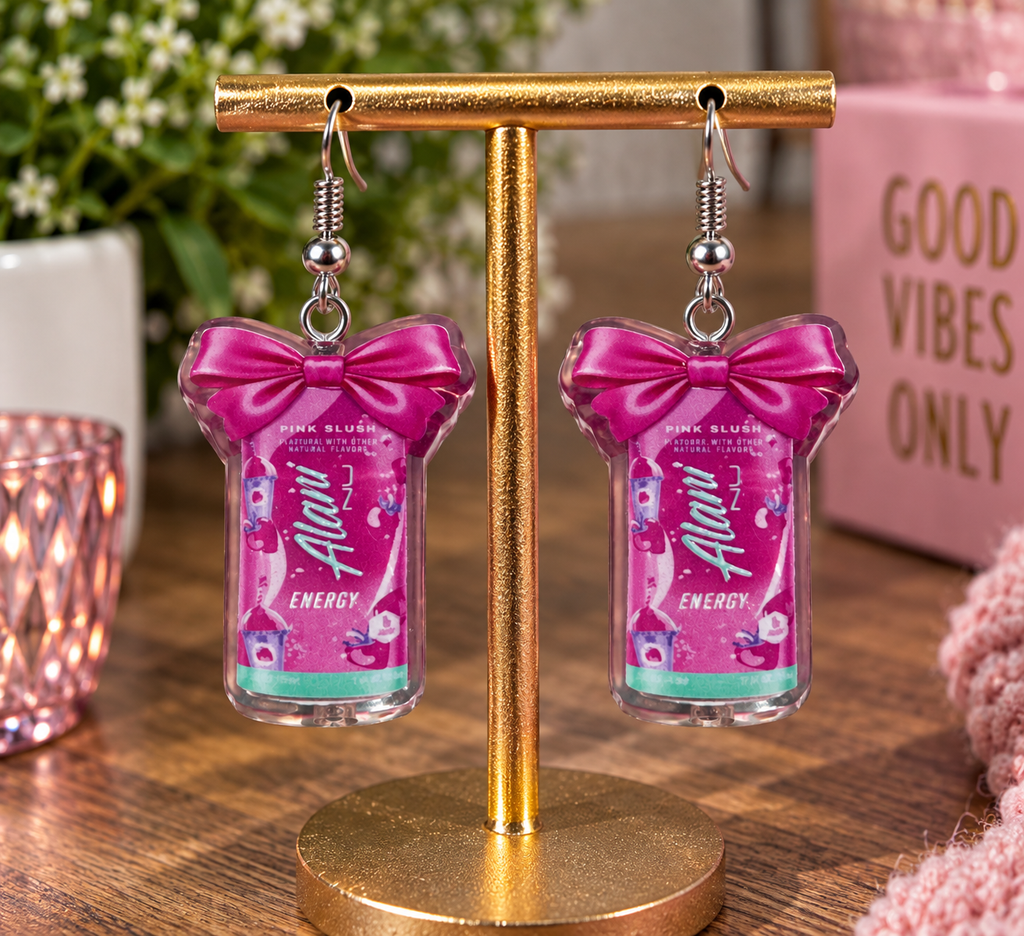 Alani Nu Pink Slush energy dangle earrings with hot pink bow on display stand with Nail'd It By Melinda branding