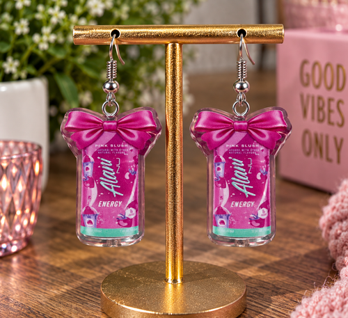 Alani Nu Pink Slush energy dangle earrings with hot pink bow on display stand with Nail'd It By Melinda branding