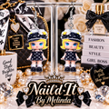 Luxury Life Blonde Fashion Doll LV Inspired Dangle Earrings on display stand with black gold backdrop
