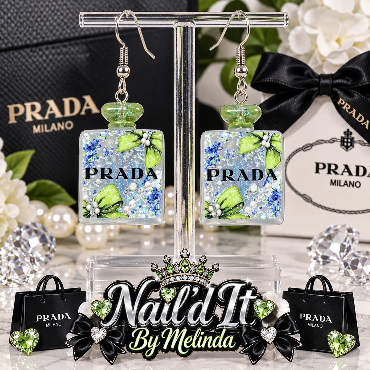 Prada Milano Green Glitter Perfume Bottle Dangle Earrings on display stand with Prada branded backdrop
