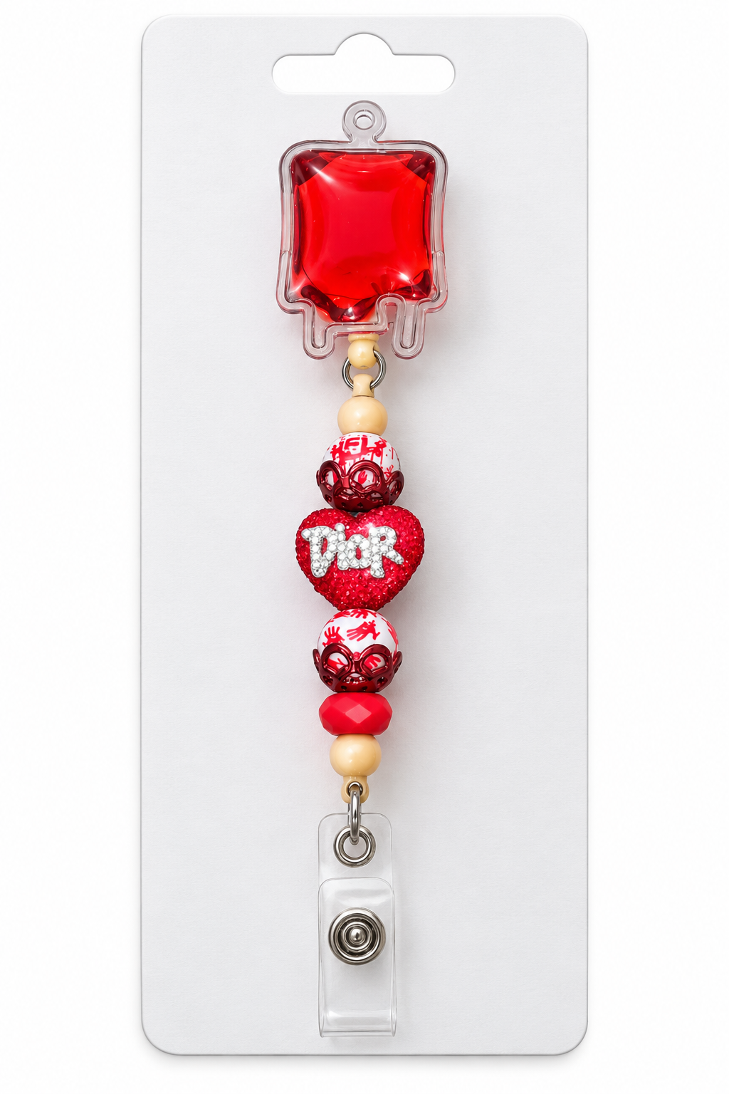 Red blood bag retractable badge reel with red and white beads and a sparkling red heart centerpiece