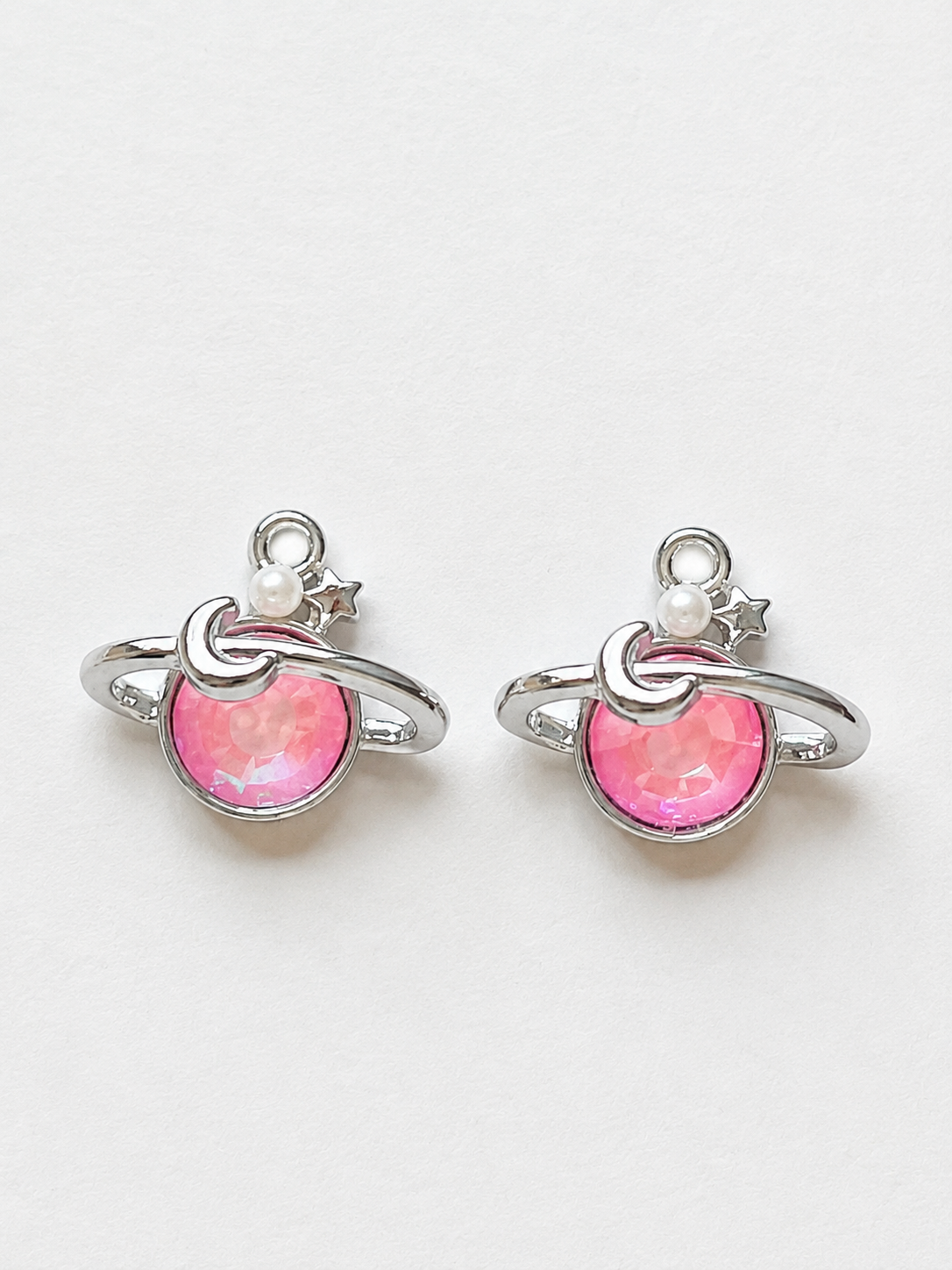 Pink crystal Saturn planet earrings with moon pearl and star accents