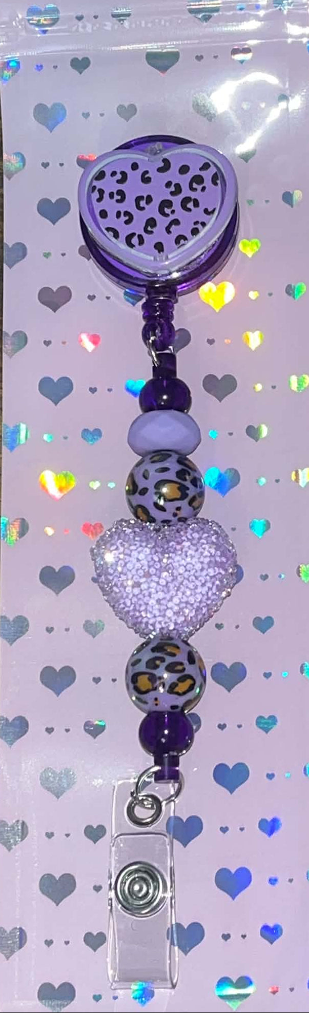 Purple heart retractable badge reel with leopard-print beads and a sparkling rhinestone heart