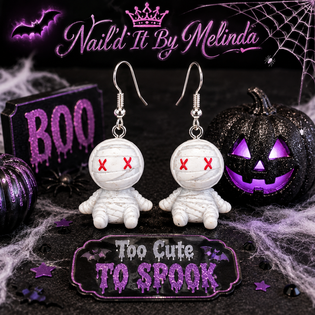 Sitting Mummy Dangle Earrings styled with Halloween decor